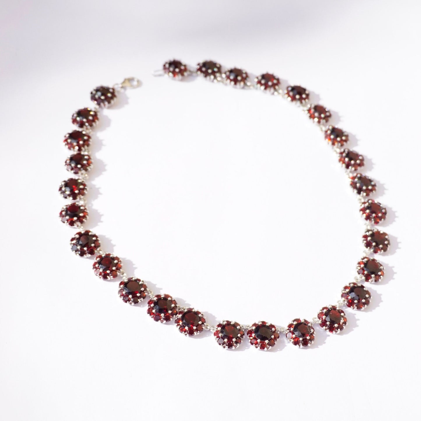 Vintage sterling silver garnet glass stone choker necklace featuring beautiful red stones in a beaded collar design.