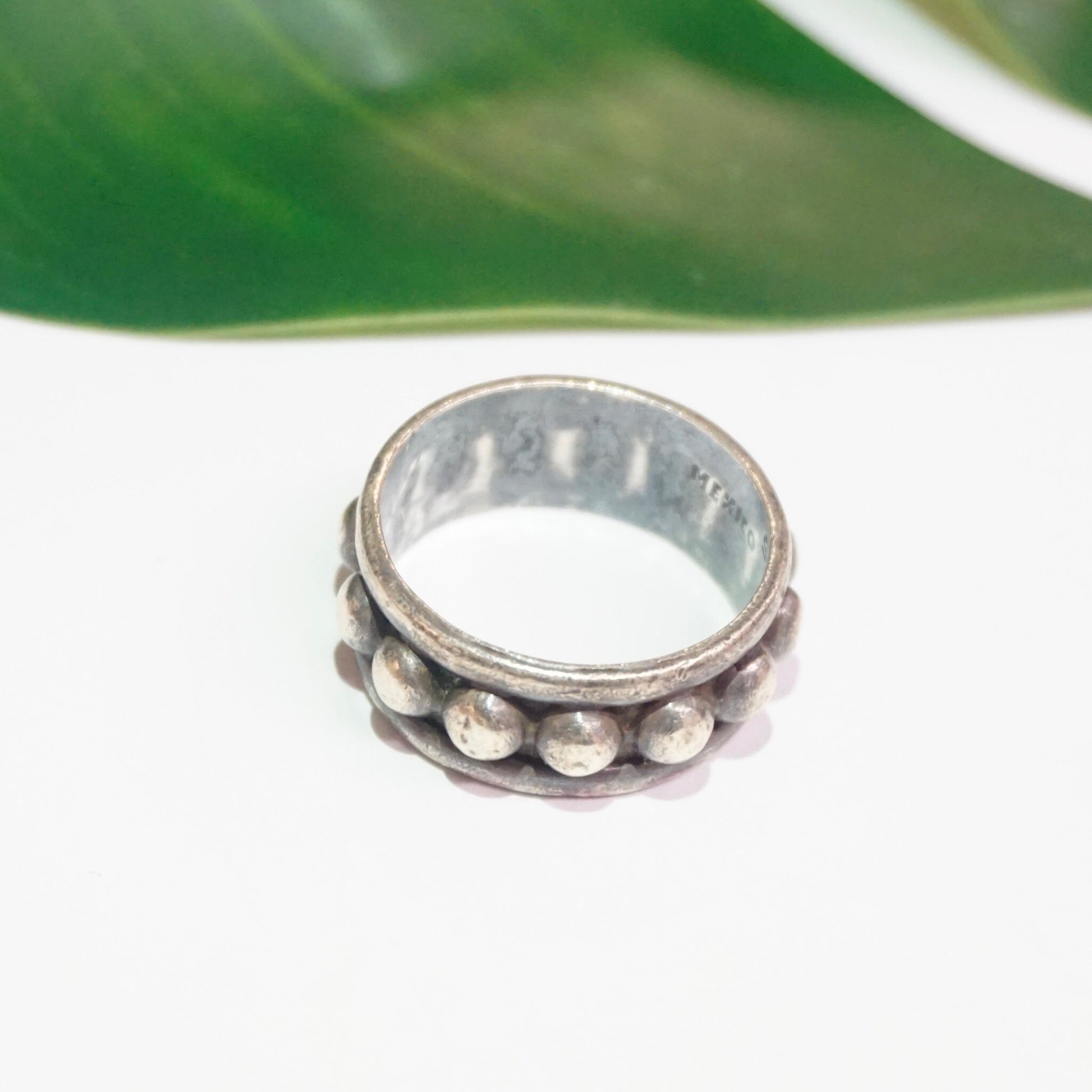 Vintage hammered sterling silver ring with circular dot details around the band, tarnished patina, large size likely for men, stamped 925 Mexico.