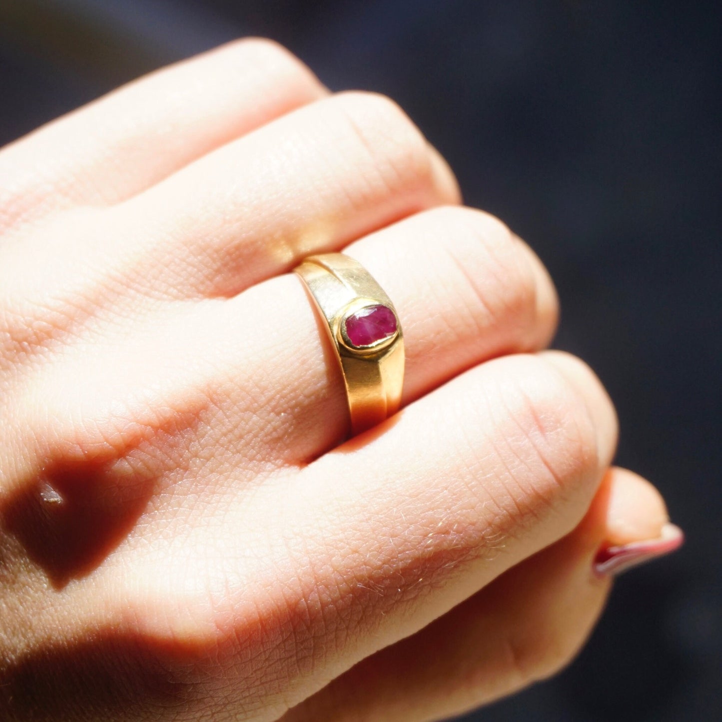 Vintage 10K gold ring with small authentic ruby gemstone on a hand, unisex gold band ring size 10 1/4 US