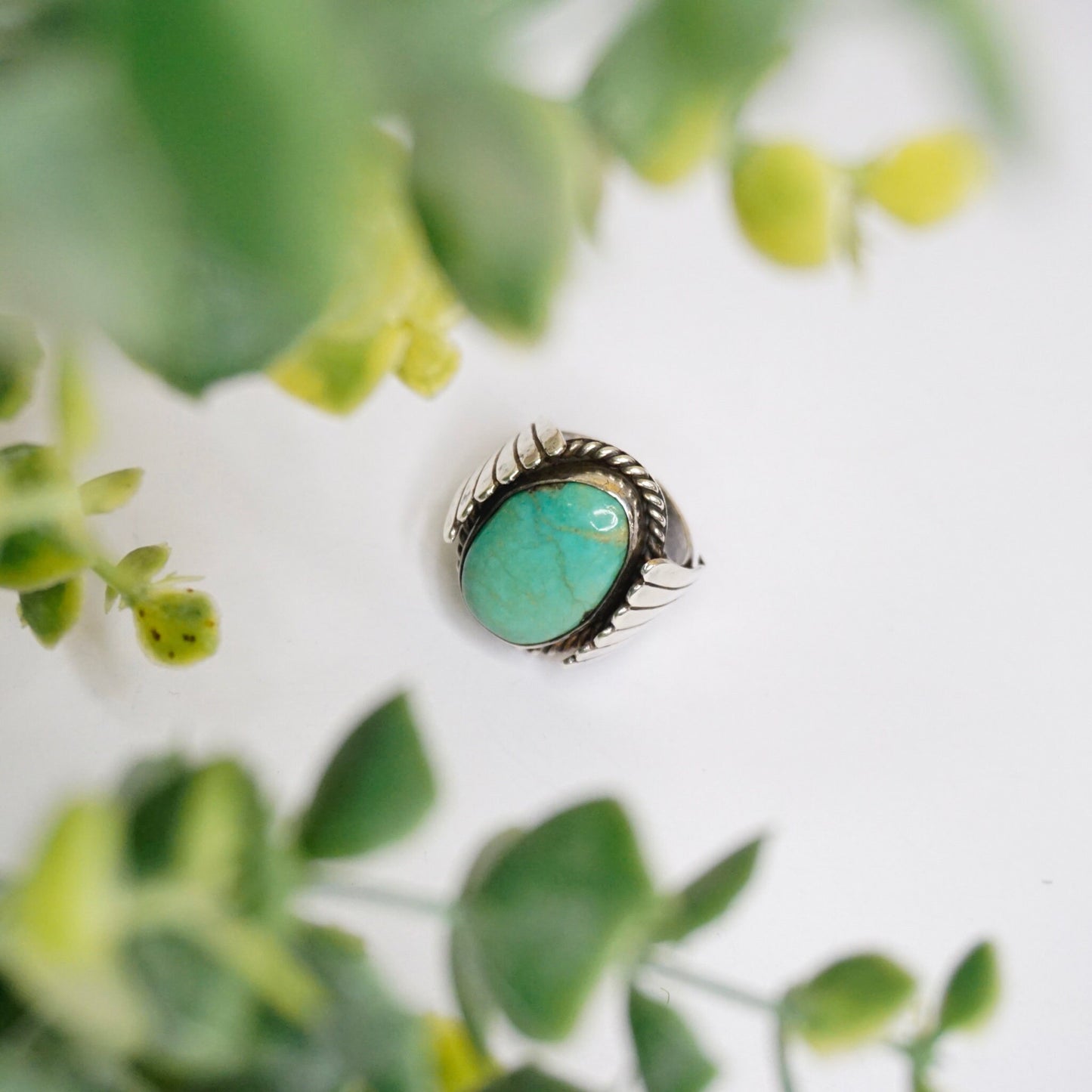 Vintage turquoise sterling silver ring with wing design and natural turquoise stone on green leaves, Native American 925 silver jewelry