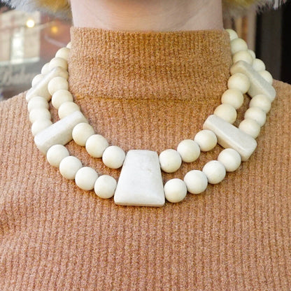 Vintage Gerda Lynggard Monies chunky two-strand wooden bead necklace with large white center stone, worn as a collar-style statement piece from the mid-20th century.