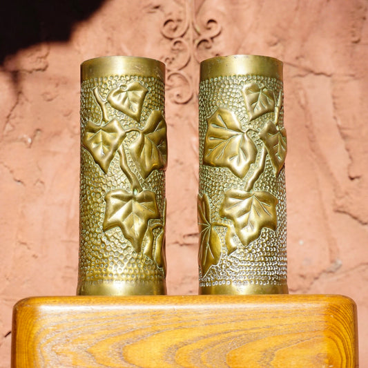 Antique French WWI trench art brush holders made from etched brass shell casings with leaf design, dated 1917.