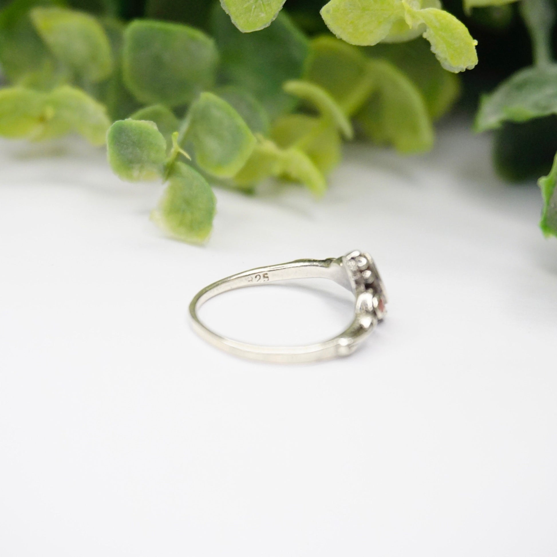 Vintage petite sterling silver ring with red stone or glass accent and swirl design details, thin 925 silver band