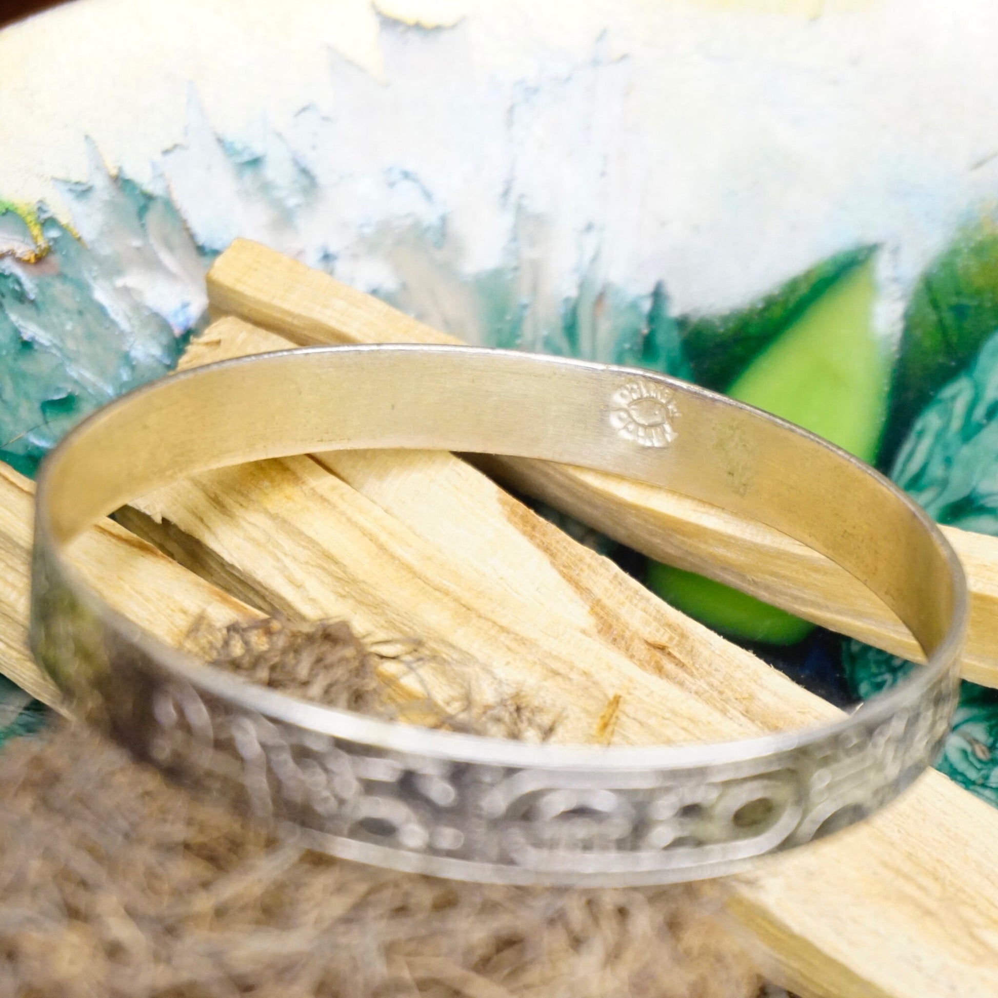 Vintage Taxco sterling silver bangle bracelet with Egyptian hieroglyphic motifs, handcrafted in Mexico from 925 silver.