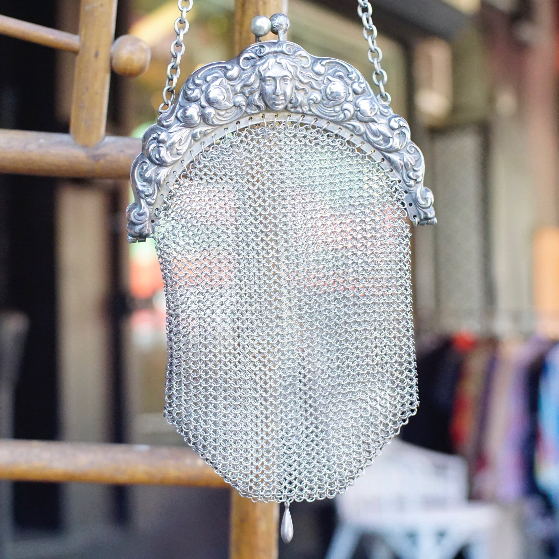 Antique Art Nouveau sterling silver chain mail purse with embossed face frame design, crafted from intricate 925 silver mesh in amazing vintage condition.