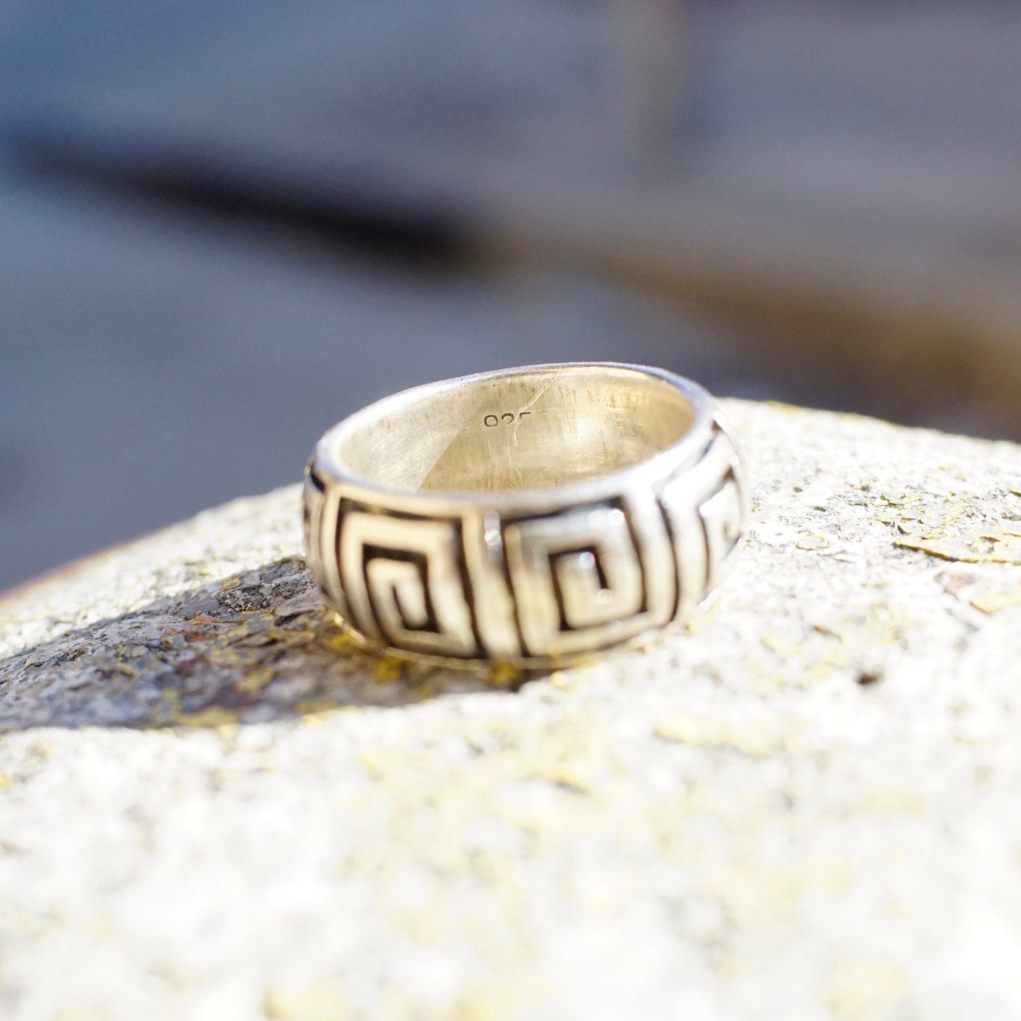 Vintage sterling silver square swirl Greek key band ring, size 9 3/4 US, thick solid 925 silver dome ring on textured rock surface