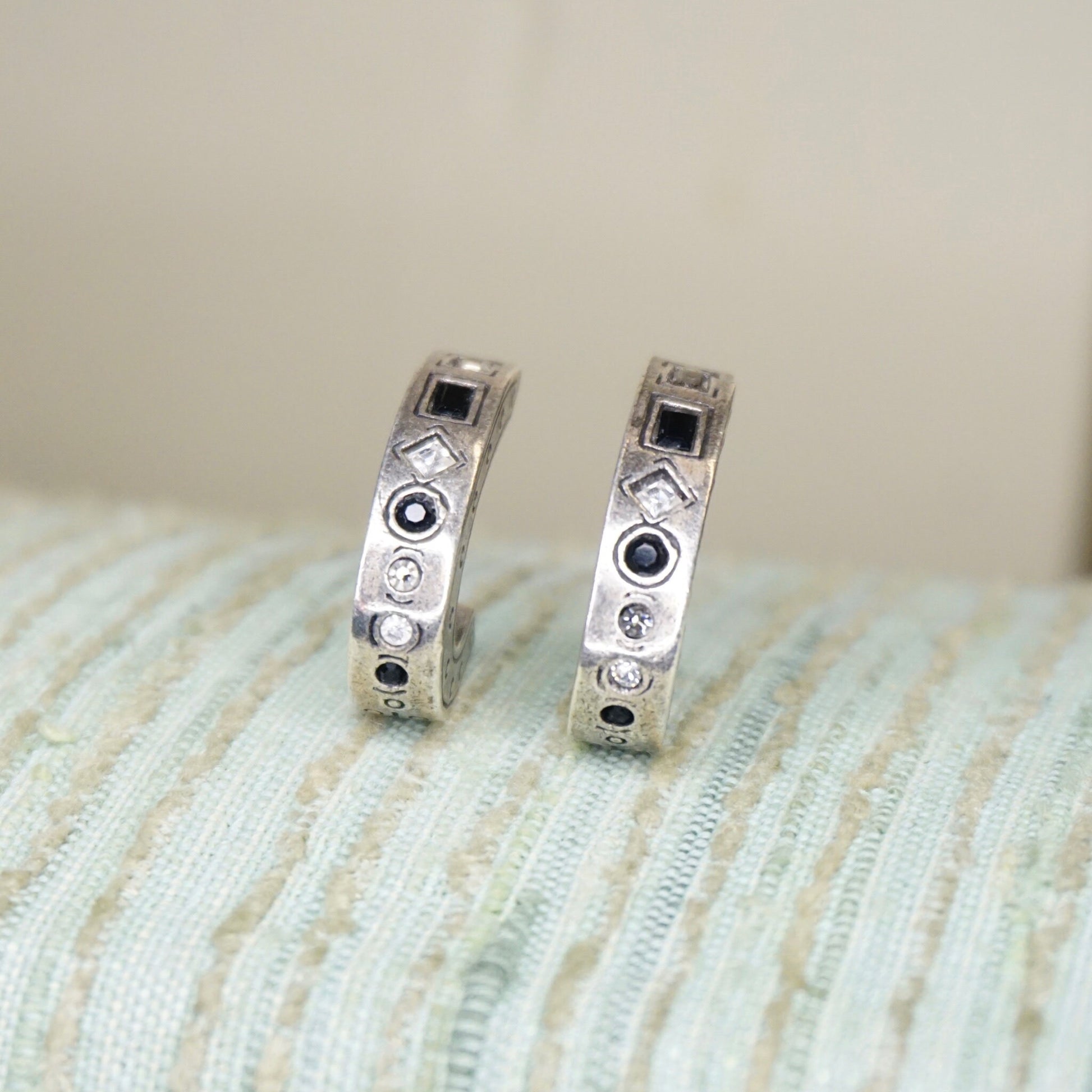 Vintage Patricia Lock silver plated half moon stud earrings with black and white crystal accents, featuring a modernist design.