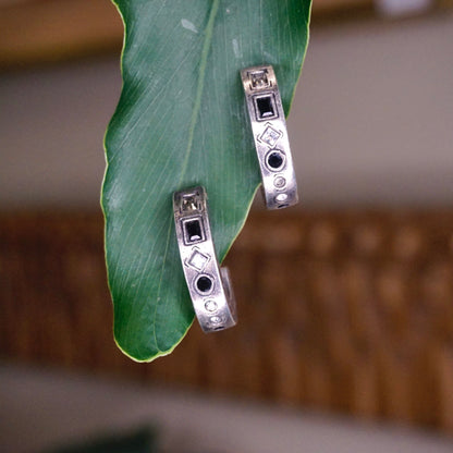 Vintage silver plated half moon stud earrings with black and white crystals on a green leaf, modernist hoop earrings