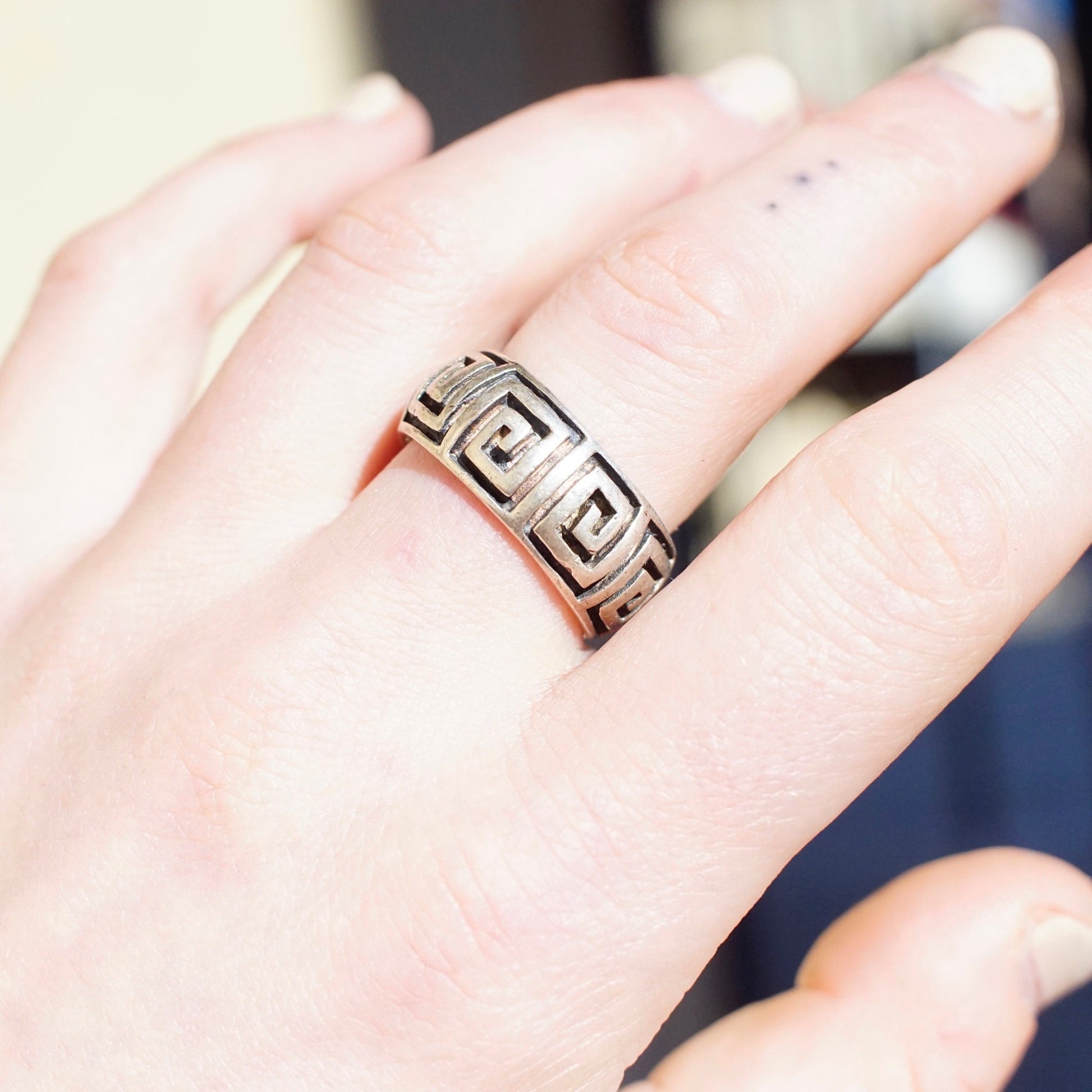 Vintage sterling silver square swirl ring on a hand, thick silver Greek key band ring, solid silver dome ring, 925 jewelry, size 9 3/4 US