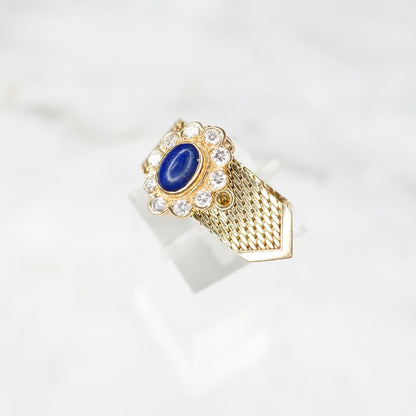 Vintage 14K yellow gold adjustable mesh belt buckle ring featuring a lapis lazuli cabochon surrounded by diamond accents, signed VCA NY 14K.