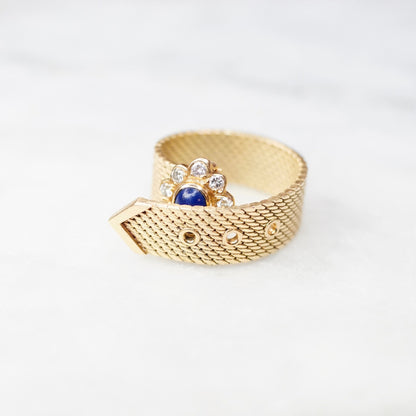 Vintage 14K yellow gold adjustable mesh belt buckle ring featuring a lapis lazuli cabochon surrounded by round brilliant cut diamonds in a flower motif, stamped VCA NY 14K, displayed on a white background.