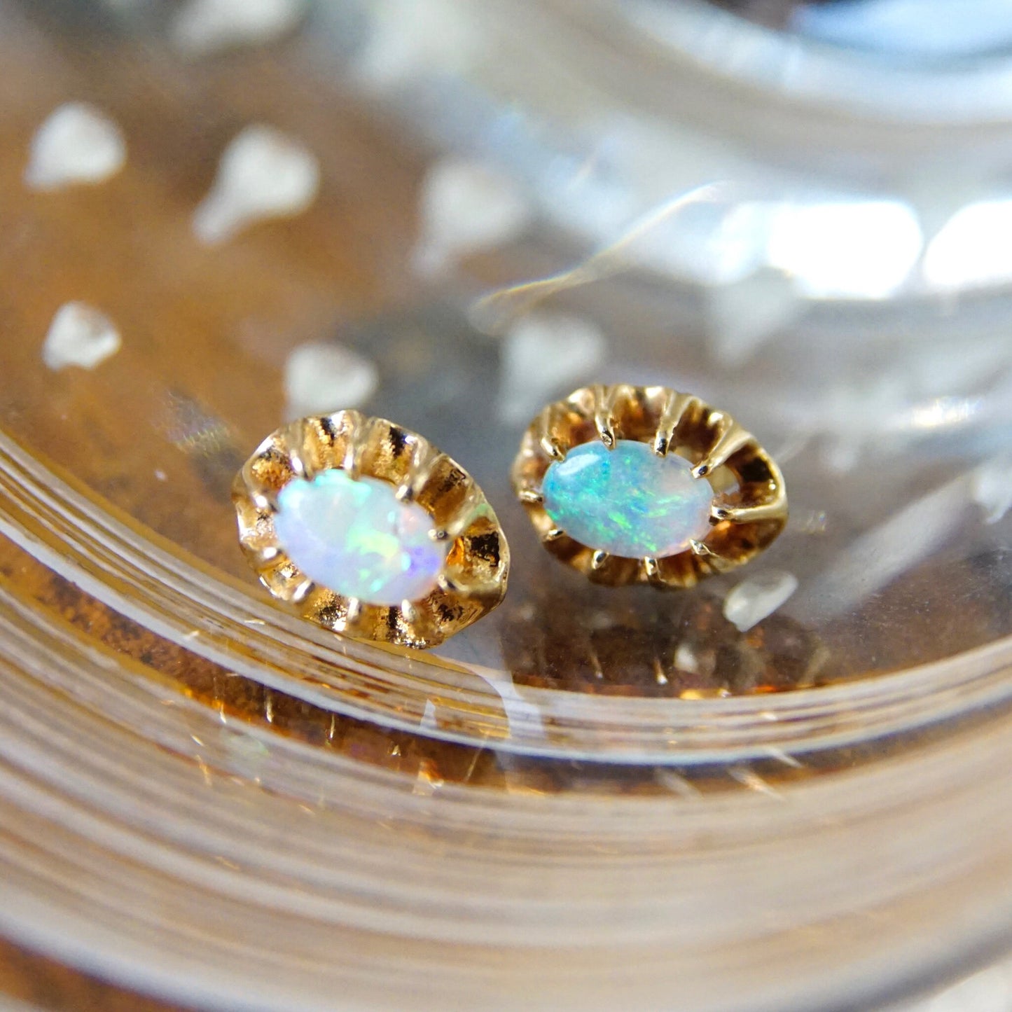 Vintage 14K gold prong set opal stud earrings with opalescent stones and gold backings, petite size, perfect as October birthstone jewelry