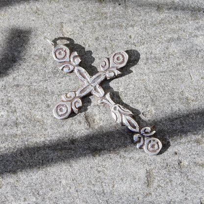 Vintage large sterling silver gothic cross pendant with ornate hammered design and oxidized silver finish, measuring 4 inches long.