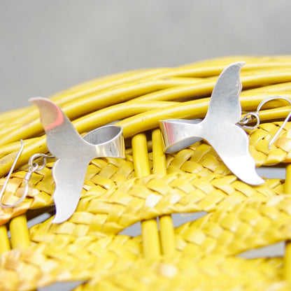 Vintage Sterling Silver Whale Tail Dangle Earrings on Yellow Woven Background