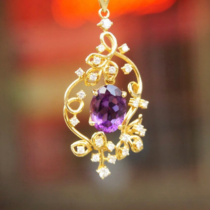 14K gold vintage pendant choker necklace featuring a faceted amethyst stone in an ornate diamond-studded gold frame, measuring 14 3/4 inches long.