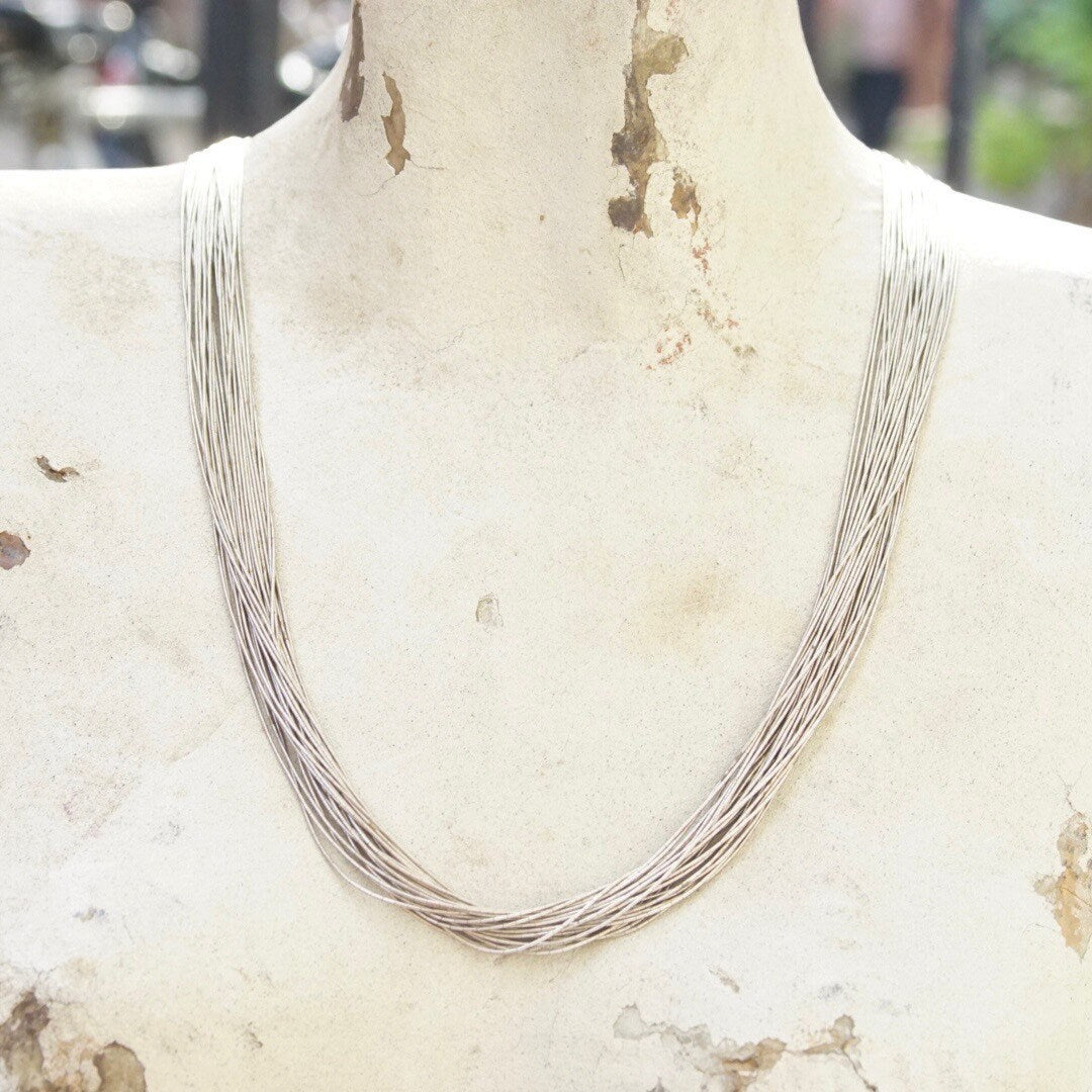 Vintage modernist sterling silver multi-strand liquid silver necklace with coned caps and hook closure, 30 inches long