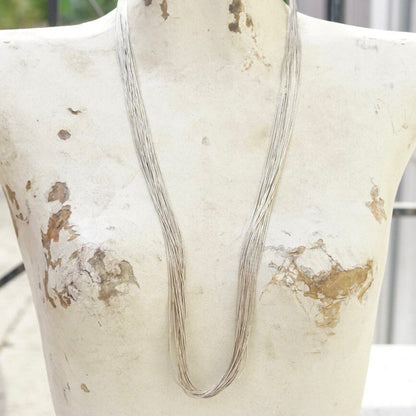 Vintage modernist sterling silver liquid silver multi-strand statement necklace with coned end caps and hook closure, measuring 30 inches long.