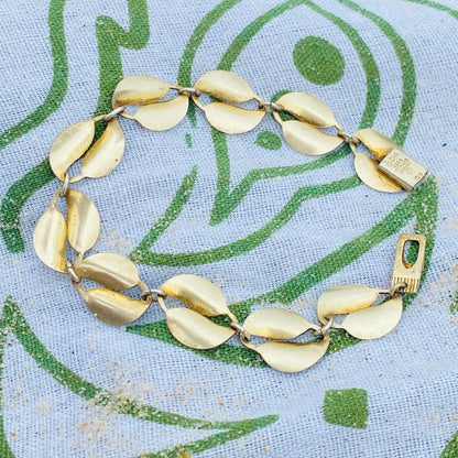 Vintage David Anderson Norway Sterling Silver Guilloche Enamel Leaf Bracelet featuring double gold-tone leaf links on a light blue floral patterned enamel background, showcasing Scandinavian 925 silver jewelry design.