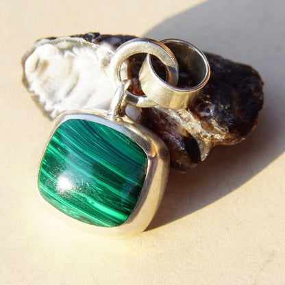 Vintage Taxco sterling silver modernist pendant with banded malachite stone, featuring a double loop necklace bail, crafted in Mexico from 925 silver.