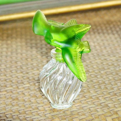 Vintage Nina Ricci Lalique frosted green glass dove stopper on a ridged clear glass perfume bottle