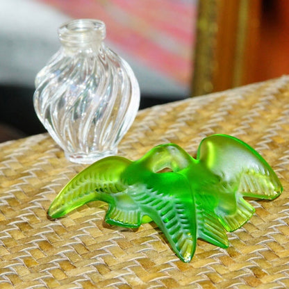 Vintage Lalique Nina Ricci perfume bottle with ridged clear glass and green frosted glass dove stopper, 3.75 inches tall