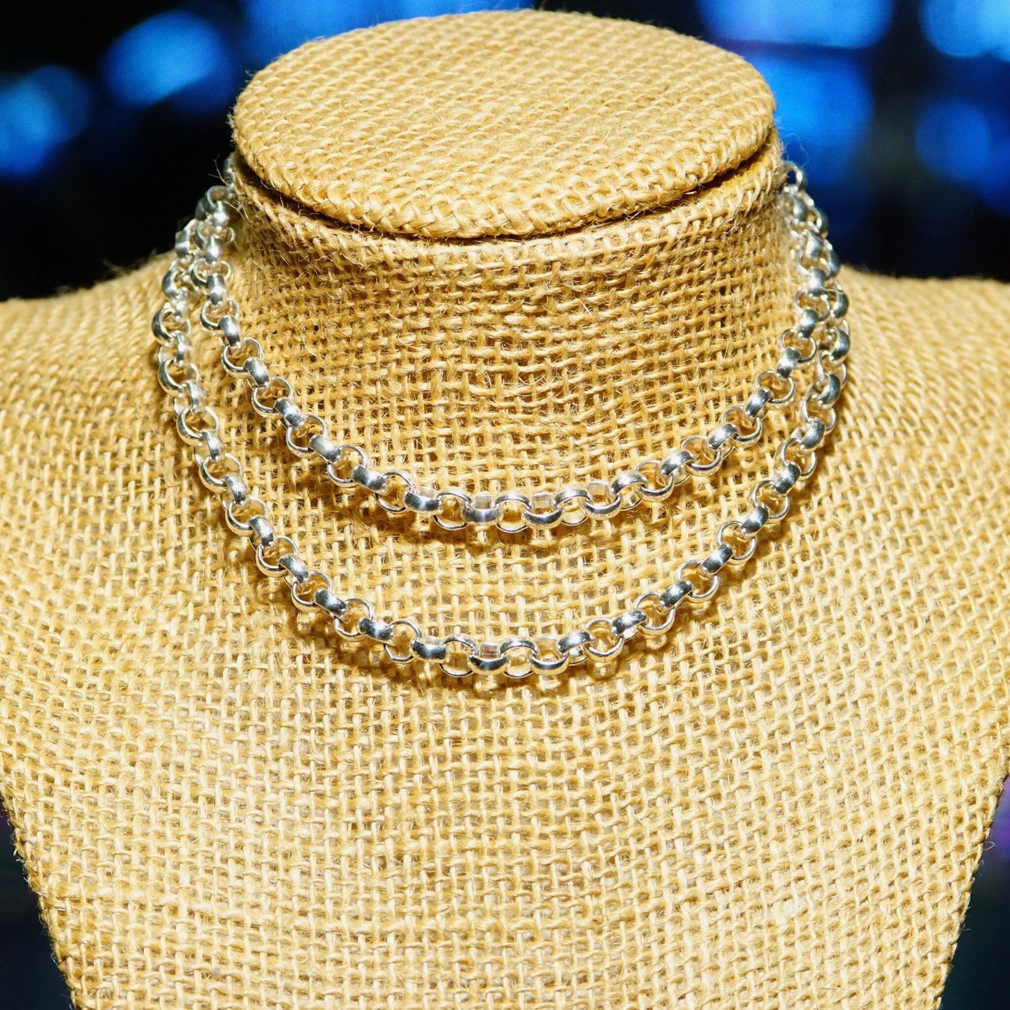 Vintage sterling silver rolo chain necklace with 1/4 inch interlocking bead links, displayed on burlap mannequin. Heavy, long unisex silver chain measuring 23 3/4 inches in length.