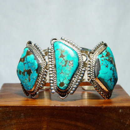 Vintage Native American turquoise cuff bracelet with three large turquoise stones set in chunky silver, handmade in Mexico, measuring 5 3/4 inches long