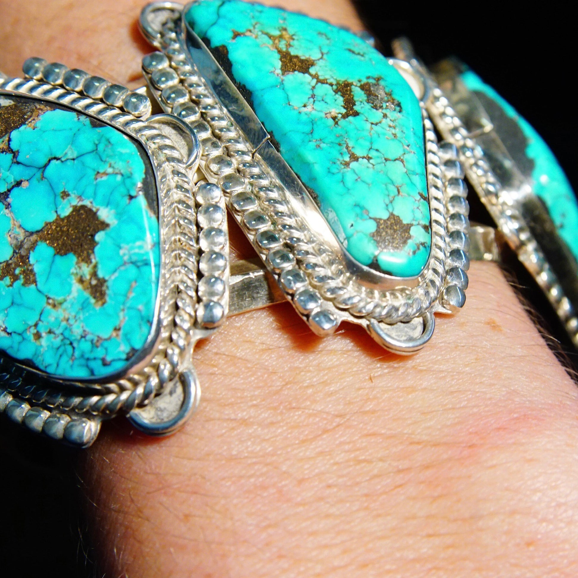 Vintage Native American turquoise cuff bracelet with large turquoise stones and chunky silver design, handmade in Mexico.