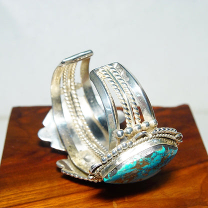 Vintage Native American silver cuff bracelet with three large turquoise stones from Mexico, measuring 5 3/4 inches long.