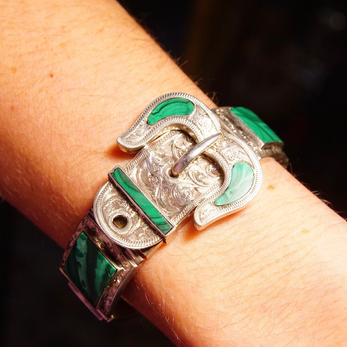 Antique Victorian silver bracelet with malachite inlay and ornate etched buckle design, measuring 7 1/8 inches long.