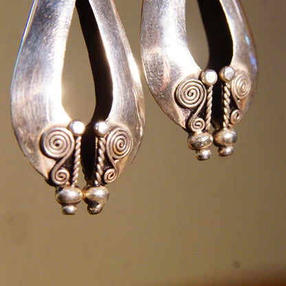 Vintage Bali style sterling silver pierced dangle earrings with puffed teardrop design and wire wrap accents, measuring 1 7/8 inches long, 925 boho accessories