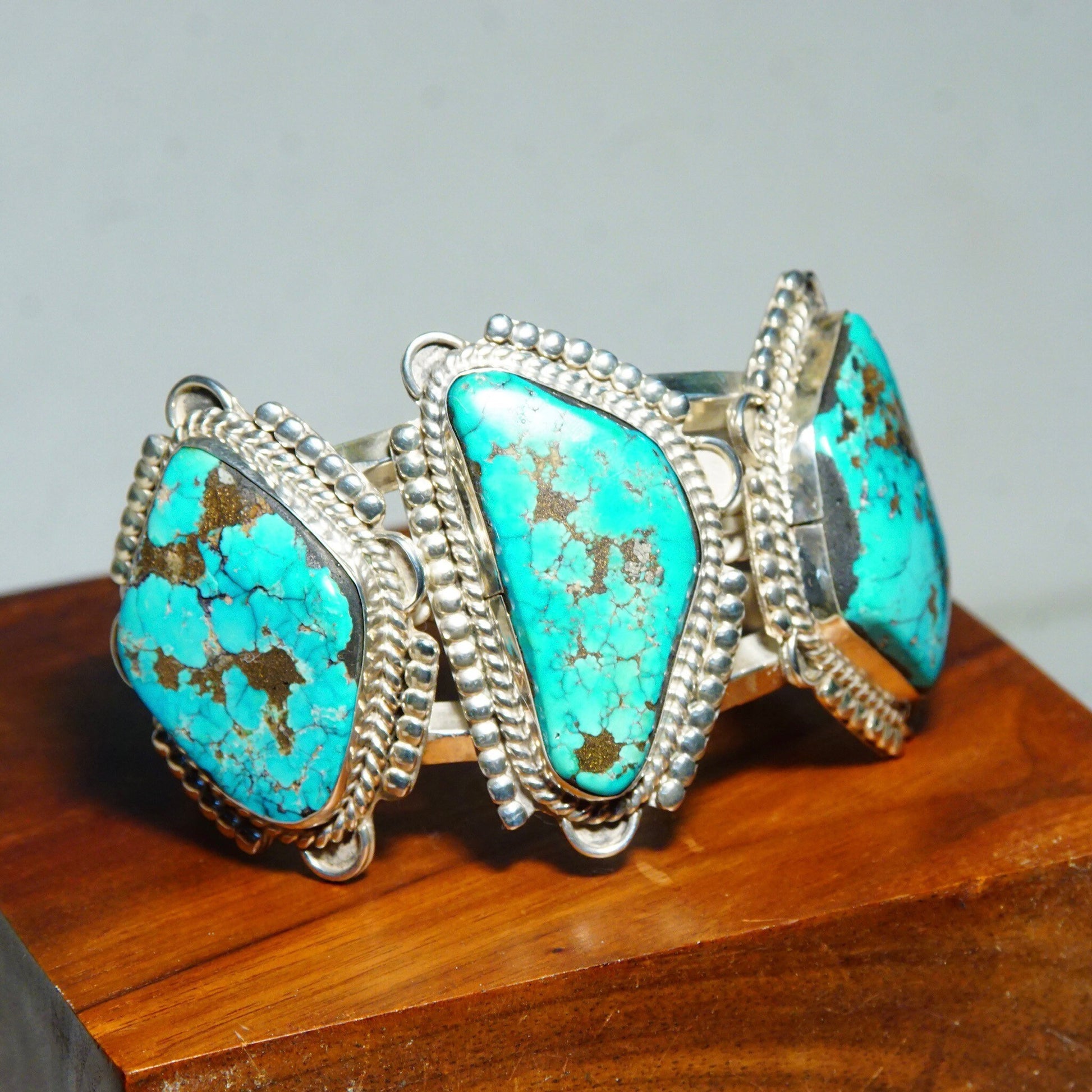 Vintage Native American turquoise cuff bracelet with chunky silver and large turquoise stones, measuring 5 3/4 inches long, crafted in Mexico.