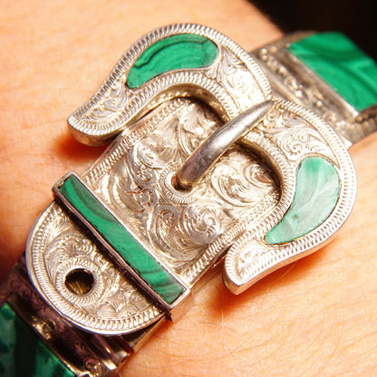 Antique Victorian silver bracelet with etched designs and malachite inlay, featuring an ornate belt buckle style clasp, measuring 7 1/8 inches long.