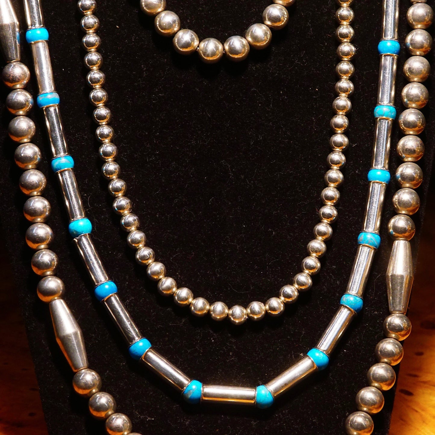 Vintage Navajo sterling silver necklace with turquoise and pearl beads, featuring barrel-shaped beads, tube beads, and turquoise spacers, measuring 32 1/2 inches long.