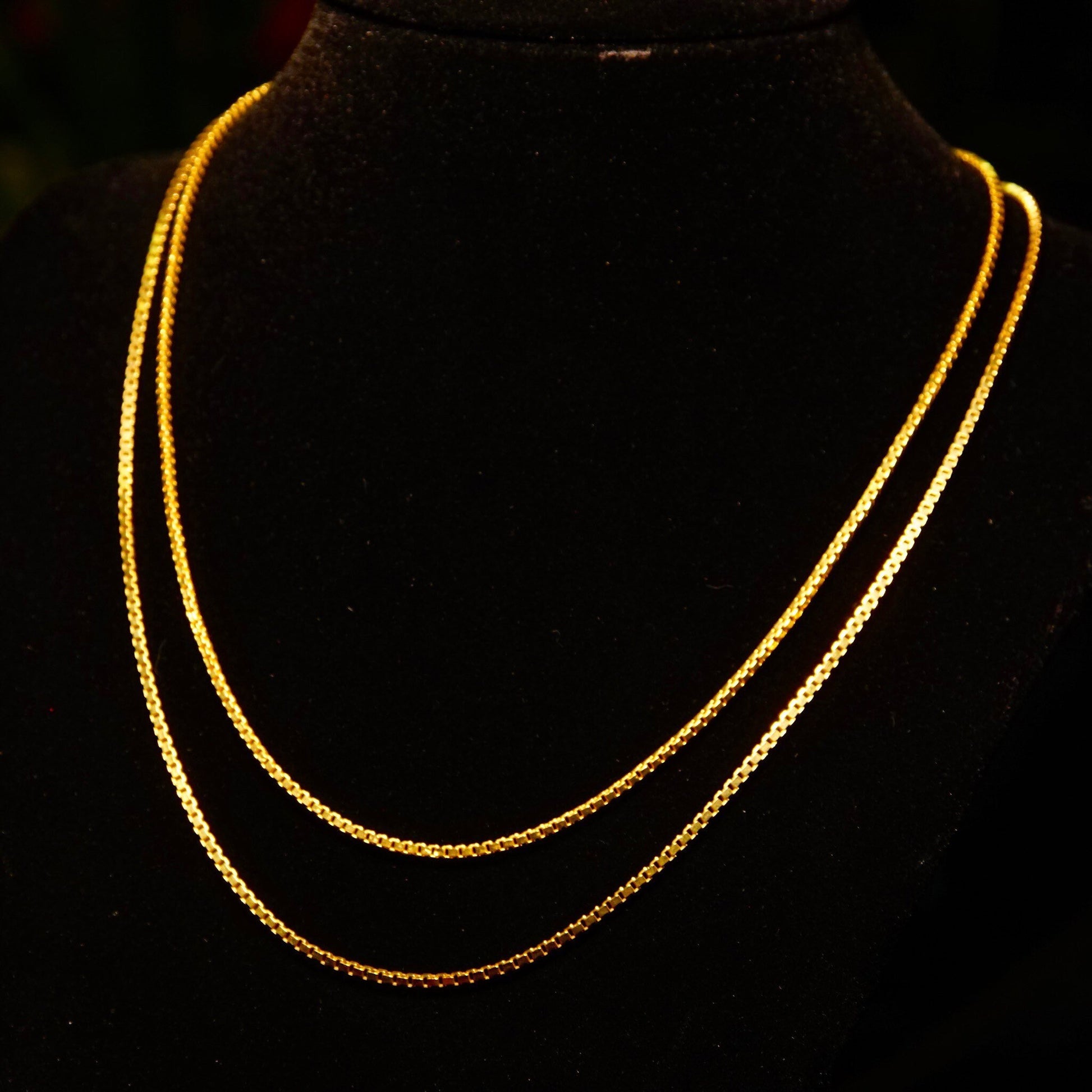 Vintage Italian 14K yellow gold box chains, 1.5mm solid gold necklaces, delicate fine jewelry chains for pendants, 16 to 18 inches long, 585 gold purity, on black background