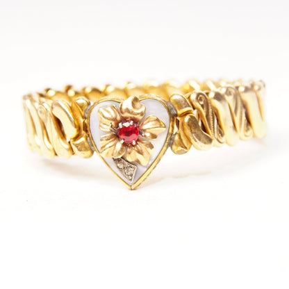 Antique Victorian gold-filled heart stretch band bracelet with diamond accent, shell inlay, faux ruby, and floral embellishment on an s-link stretch band measuring 5 inches in length.