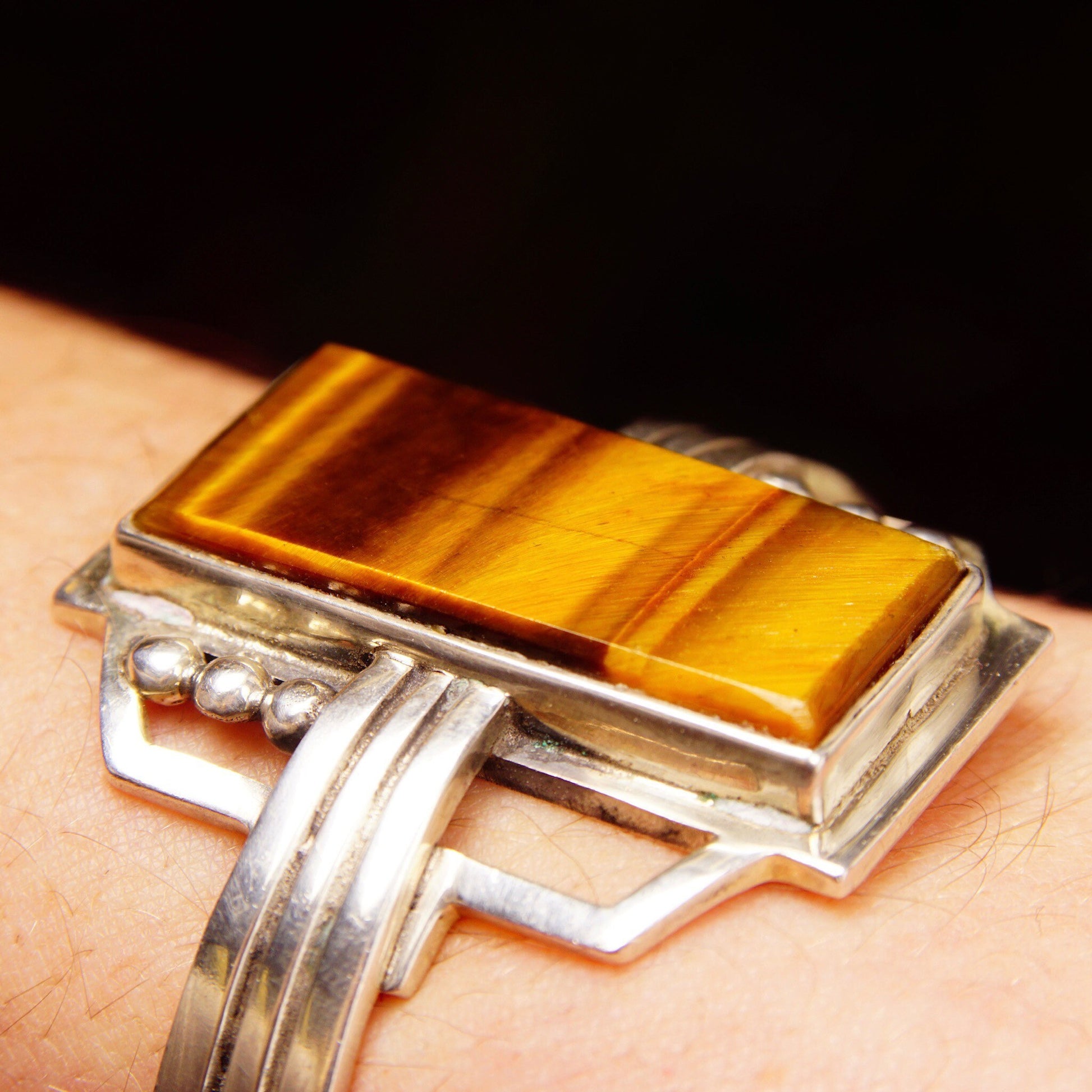 Vintage TAXCO Sterling Silver Tigers Eye Cuff Bracelet featuring a polished rectangular gemstone set in a modernist silver cuff engraved with "Mexico 925", measuring approximately 5 1/8 inches in length.