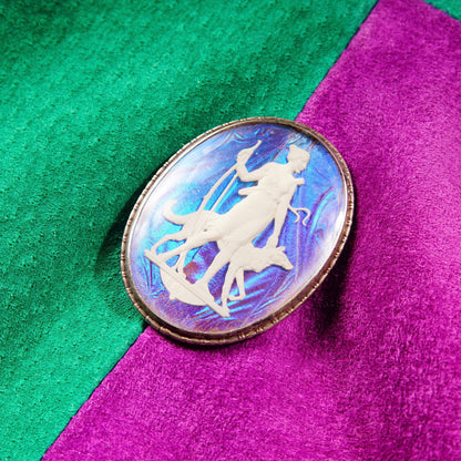 Alt text: Vintage Art Deco sterling silver brooch featuring an iridescent sulfide cameo of a Grecian goddess on a colorful butterfly wing background in hues of green and purple, made in England, measuring 1 3/4 inches long.