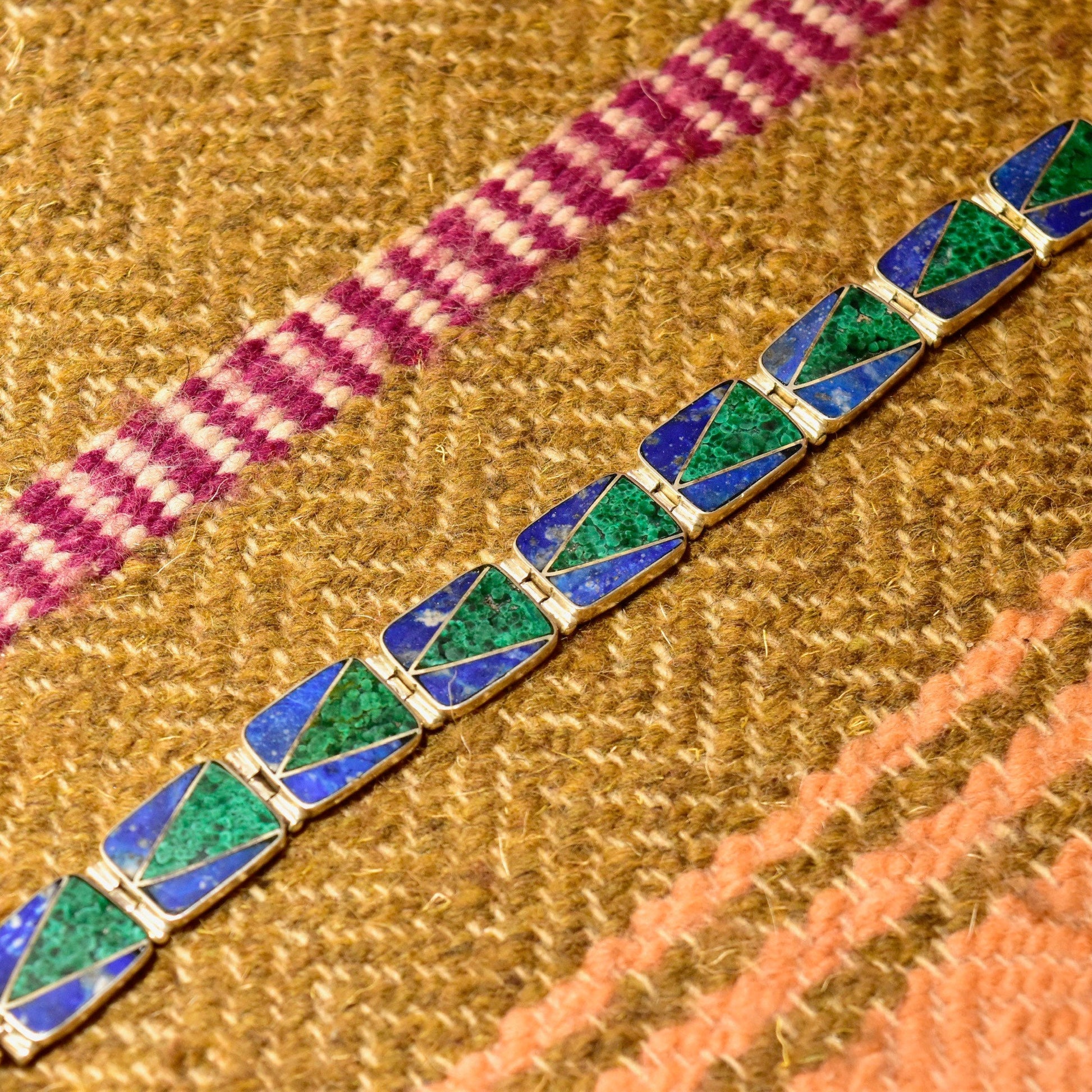 Vintage sterling silver link bracelet with geometric malachite and lapis lazuli inlay, measuring 7 1/4 inches long, in a bohemian modernist style.