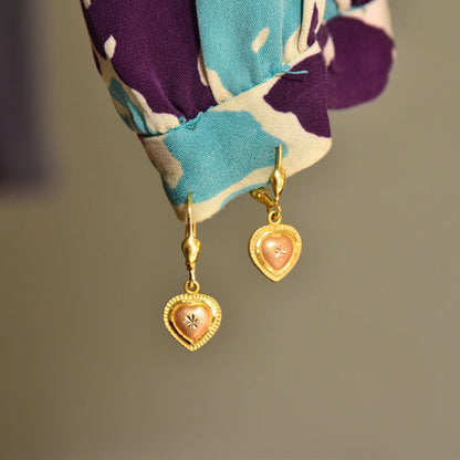 Vintage 14K yellow and rose gold heart dangle earrings with diamond-cut accents, 585 leverbacks, hallmarked ARPAS 14K, measuring 26mm in length.