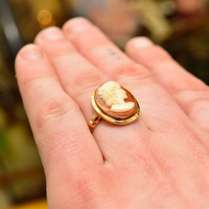 Vintage 14K gold cameo ring featuring an elegant carved shell cameo of a woman's profile set in a classic gold mounting, sized to 8 1/2 US.