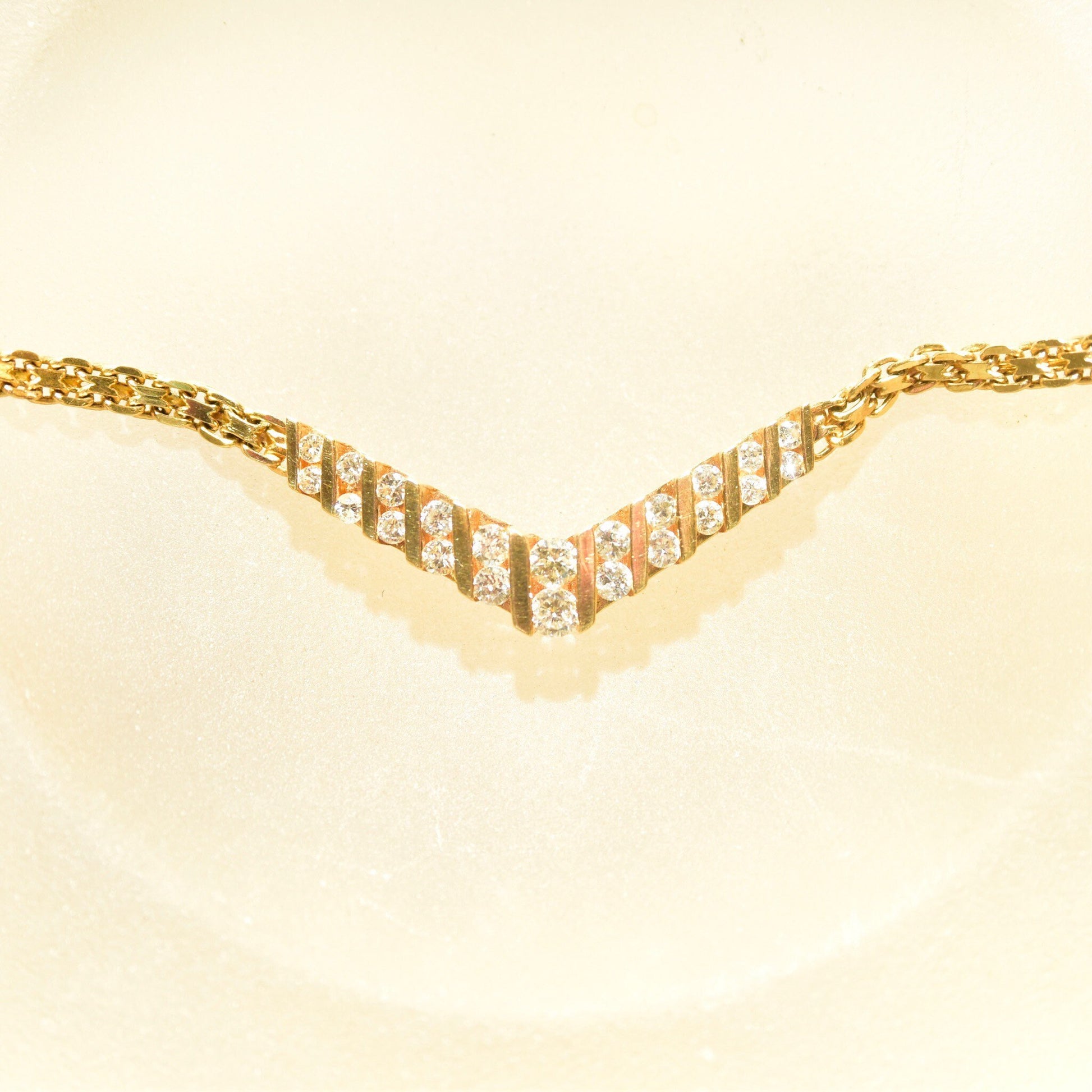 14K yellow gold diamond chevron necklace with channel set brilliant cut diamonds on a mesh link chain, 15 1/4 inches long