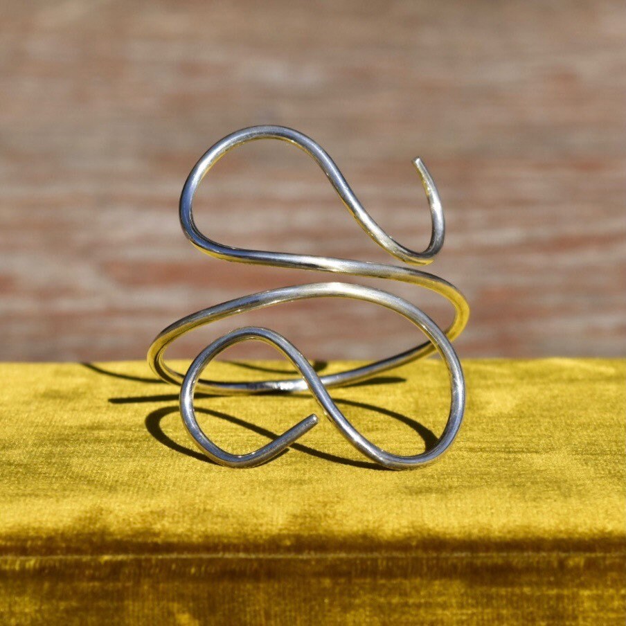 Vintage solid sterling silver wire wrap cuff bracelet featuring minimalist swirl design. Bohemian style 925 silver adjustable bracelet, 7 1/2 inches.