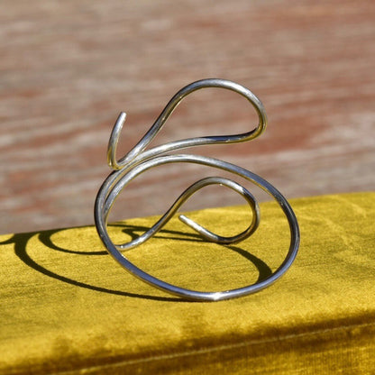 Vintage sterling silver wire wrap cuff bracelet with minimalist swirl design, adjustable to 7 1/2 inches, bohemian style 925 silver jewelry.