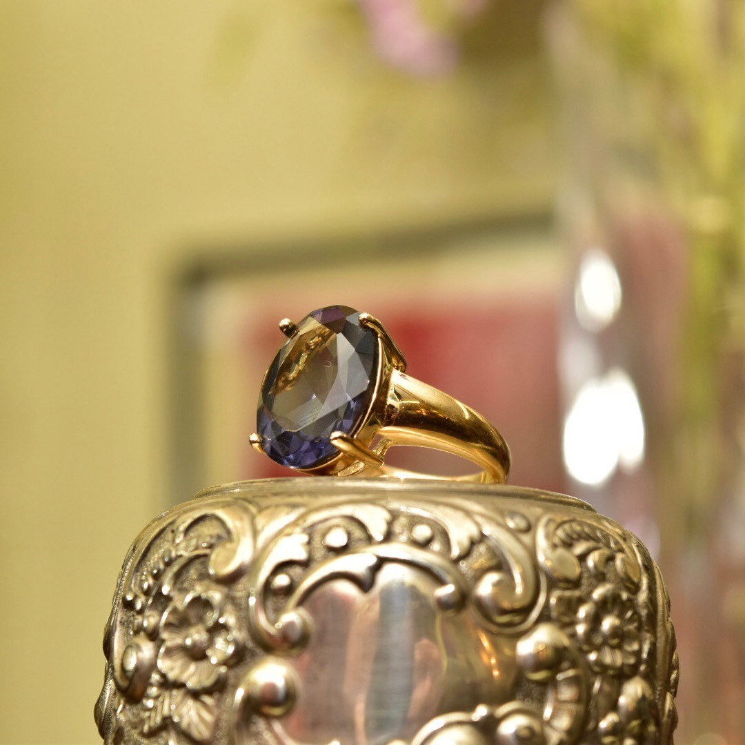 Vintage gold-plated sterling silver ring with oval simulated blue gemstone, ornate cocktail ring design in 925 gold-tone, size 7 US.