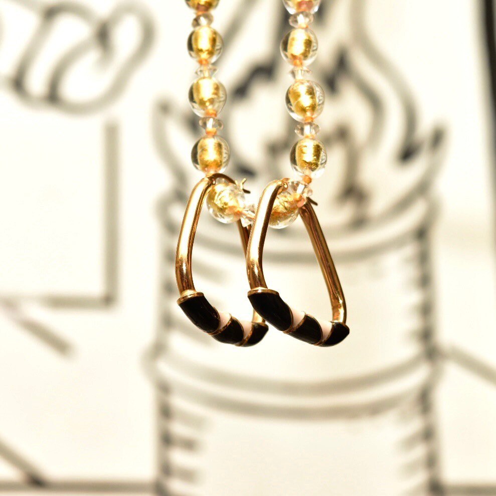 14K gold triangle hoop earrings with black and beige enamel designs, 35mm modernist statement hoops