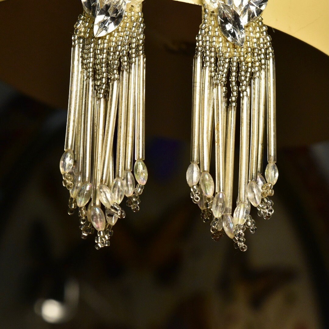 Vintage beaded chandelier clip-on earrings with ornate design and teardrop tassels, measuring 3 3/4 inches long.