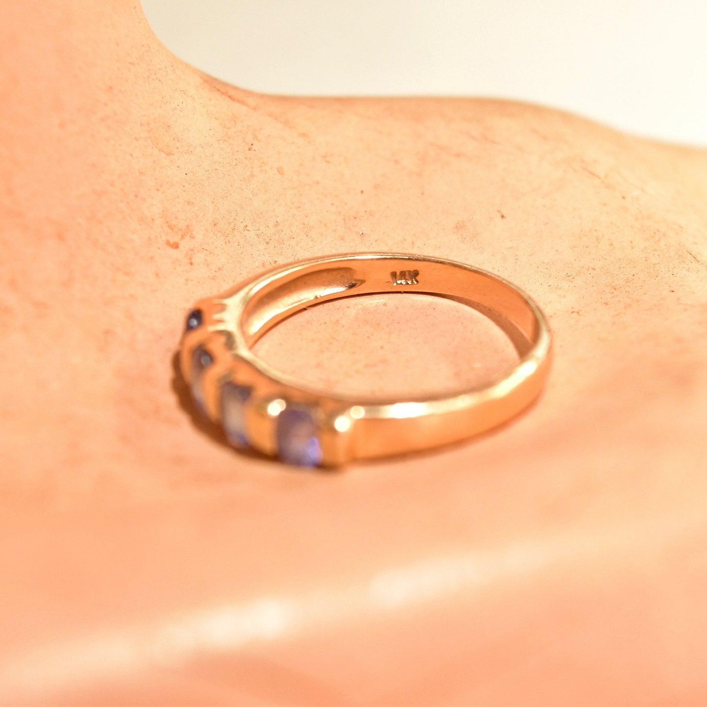 Vintage 14K yellow gold band ring with four tanzanite stones, half eternity style. Can be used as anniversary, engagement or stacking ring. 585 gold purity, ring size 7 1/4 US.