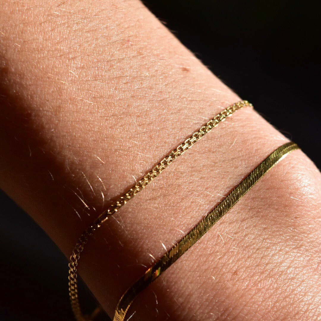 14K gold bismark chain bracelet with 2mm flat mesh links and spring-ring clasp on wrist, minimalist jewelry, 7 inches long