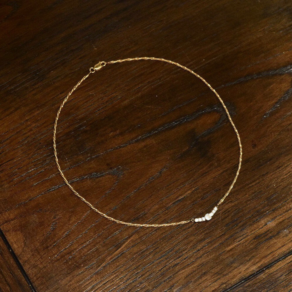 14K yellow gold diamond bar collar necklace with shared prong setting on delicate 2mm Singapore chain, elegant 17 1/2 inch length.